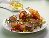 Courgette-wrapped pork medallions and bread salad