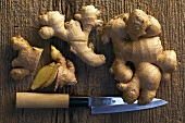 Ginger roots with knife
