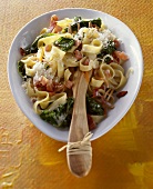 Tagliatelle with kale, ham and Parmesan