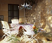 Table with pomegranates on a veranda