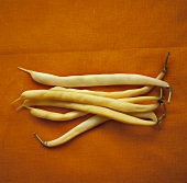 Wax beans against orange background