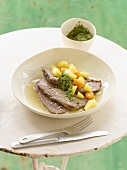 Boiled beef with pesto and bouillon potatoes