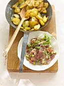 Ox muzzle salad with fried potatoes