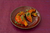 Roasted pumpkin wedges with herbs