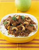 Lamb curry with cashew nuts on rice