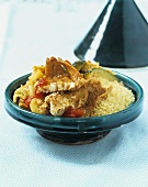Couscous with fish and vegetables in a tajine