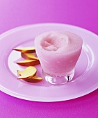 Pink champagne sorbet with peach slices