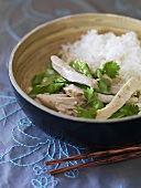 Poached chicken breast with coconut sauce, coriander & rice