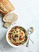Spaghetti with olives, dried tomatoes and basil