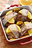 Bacon-wrapped chicken with orange slices