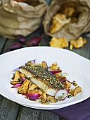 Fish fillet with chanterelles and onions