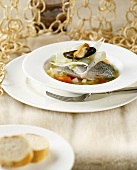 Sea bass fillet and mussels in broth