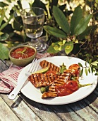 Grilled meat with tomato sauce and chillies