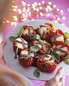Stuffed peppers topped with anchovies and cheese