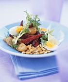 Lukewarm vegetable salad with beetroot and egg
