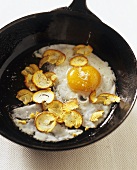 Truffle fried egg with Caesar's mushrooms in frying pan