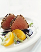 Pork fillet in spice crust with balsamic peaches