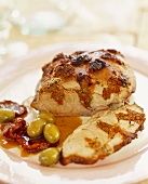 Roast pork stuffed with dried tomatoes and olives