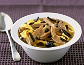 Beef tongue, truffles and ribbon pasta in broth