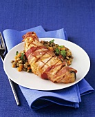 Bacon-wrapped salmon with lentil salad
