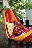 Hammock with cushions in garden