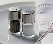 Place-setting with salt and pepper shakers