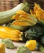 Yellow and green courgettes and courgette flowers