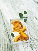 Goat's cheese fritters with olive oil foam and peaches