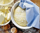 Yeast dough, pieces of butter and eggshells