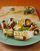 Aubergine rolls and courgette packages