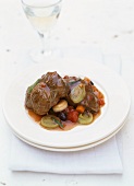 Veal legs with olives