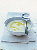 White cream of bean soup drizzled with olive oil