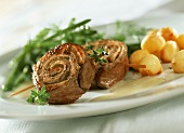 Entrecote roulade with mustard sauce, beans and potatoes