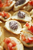 Canapes with tomatoes and olive cream