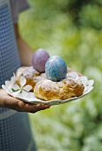 Backed Easter nests with coloured eggs