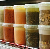 Various different homemade sauces in preserving jars