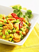 Carrot curry with peas and chilli peppers