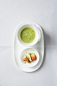 Pea and lettuce soup with semolina dumplings and crayfish