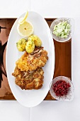 Veal escalope with parsley potatoes and cucumber salad