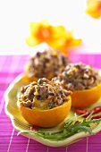 Oranges filled with minced meat and mushrooms