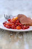 Duck breast with honey, apricots and cranberries