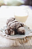 Chocolate crinkle cakes and glass of milk