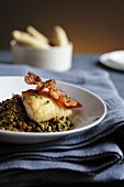 Cod with bacon on a lentil salad