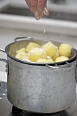 Potatoes being sprinkled with flour