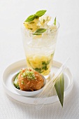 A pineapple drink with a scallop