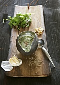 Herb dip with garlic in a gravy boat