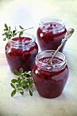 Three jars of redcurrent and apple jam