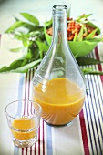 Sea buckthorn juice in a bottle and a glass