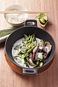 Beef with a green curry and coconut sauce