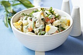 Vegetable salad with peas and boiled eggs